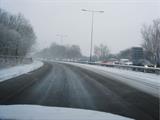Snowy winding oad pic from inside car_heavy traffic_winter-driving
